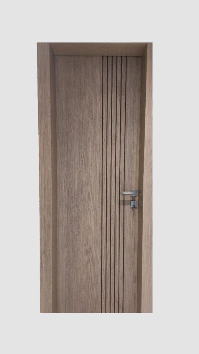 Light oak engineer door with vertical reeded band and steel lever