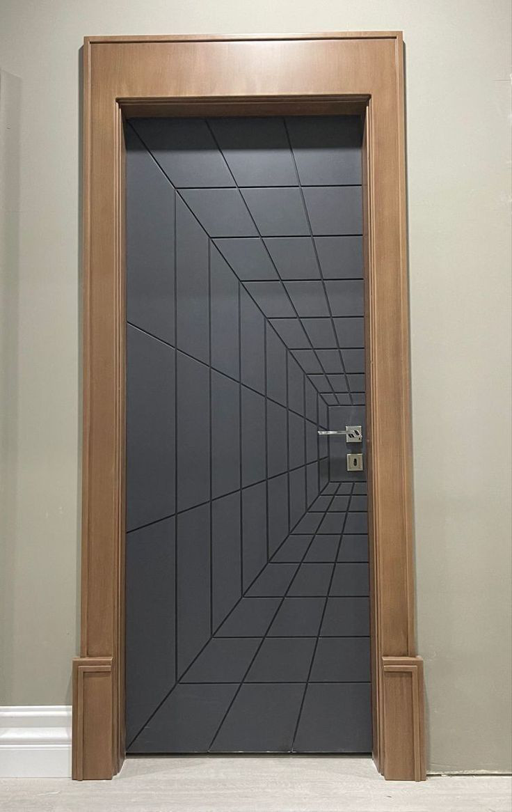 Charcoal engineer door with routed perspective grid in a wooden frame