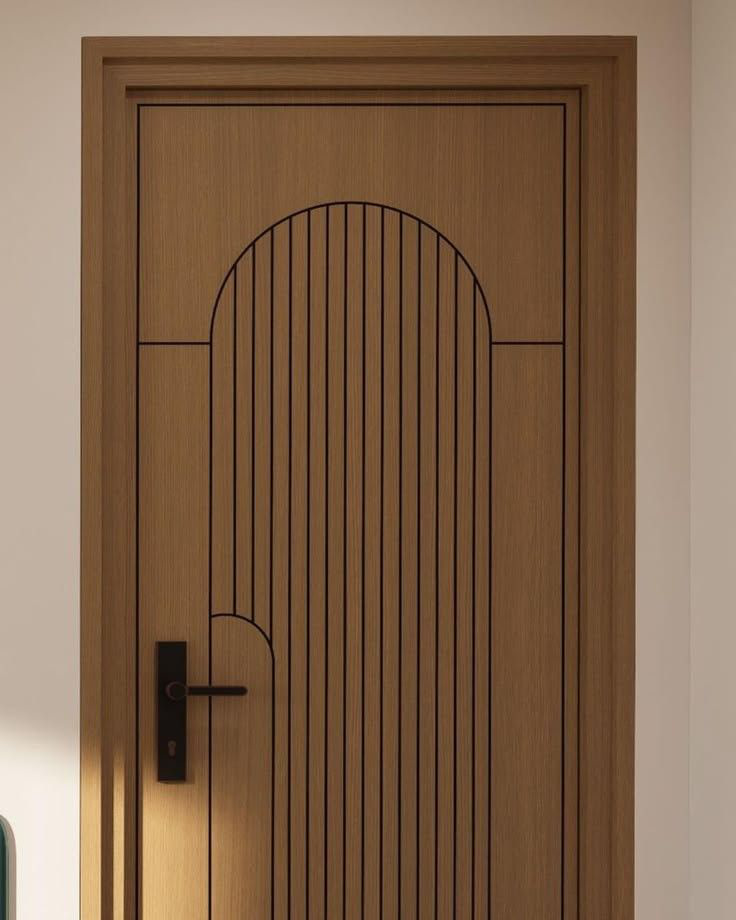 Teak engineer door with a reeded arch routed into the centre panel