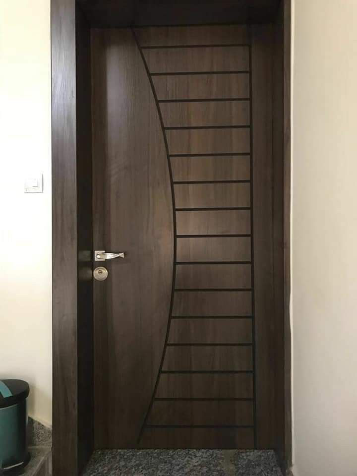 Dark walnut engineer door with sweeping curved ladder grooves
