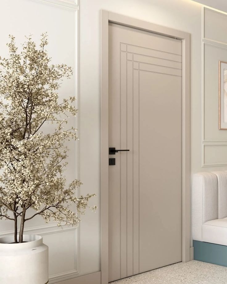 Ivory painted door with stepped linear grooves and black lever handle