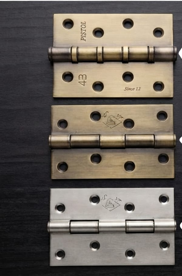 Three heavy duty door hinges in brass and stainless steel